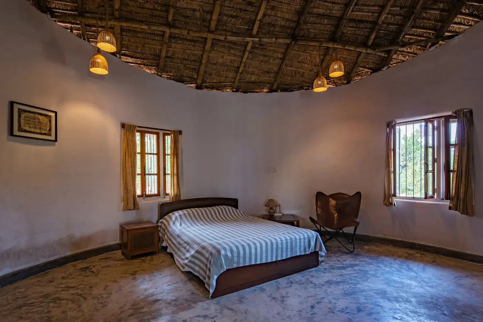 Bedroom with lime-washed walls and timber ceiling, Eco Vacation House