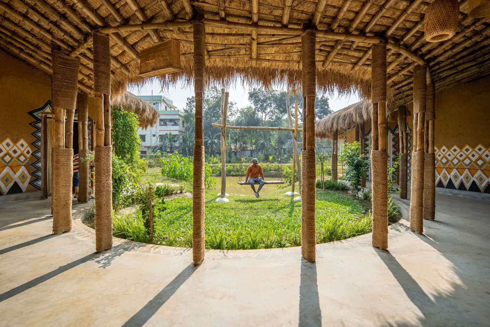 Open veranda on bamboo posts catching the breeze, Eco Vacation House