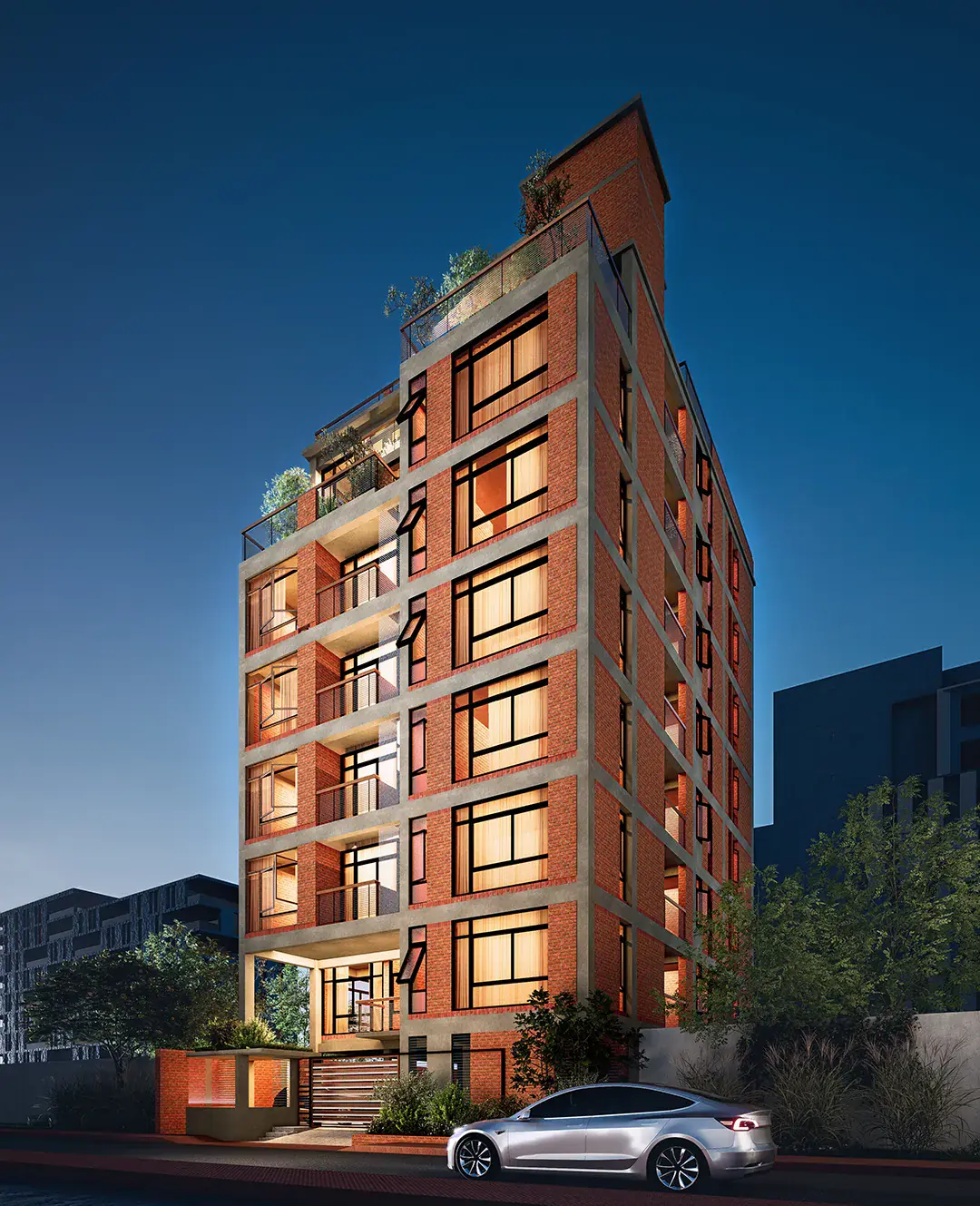 Rokon Residence at night, warm light behind brick screens